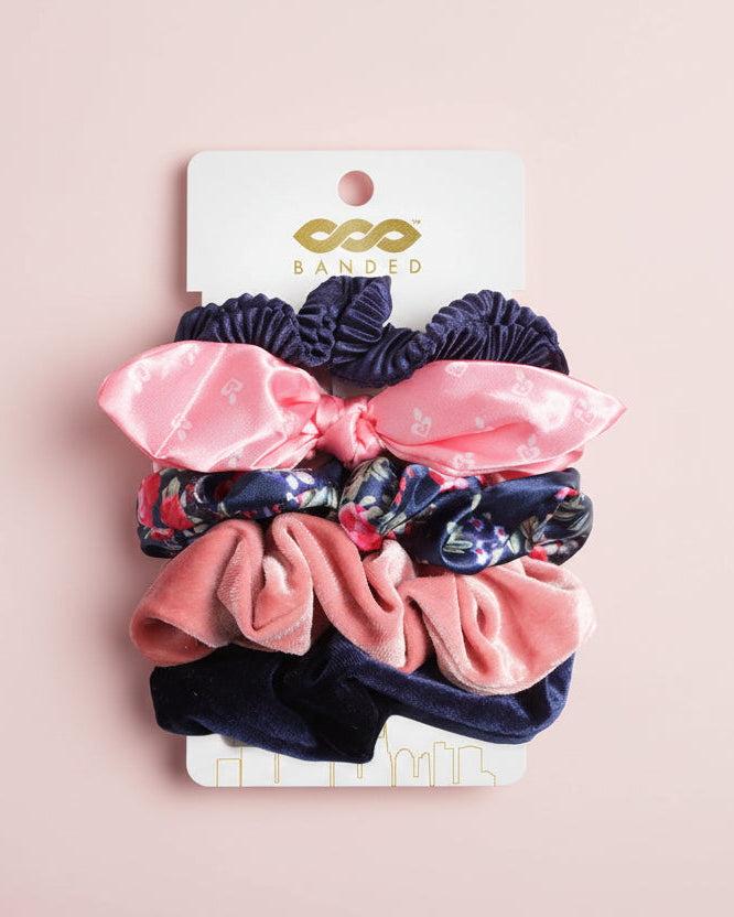 Set of colorful scrunchies on a branded card 