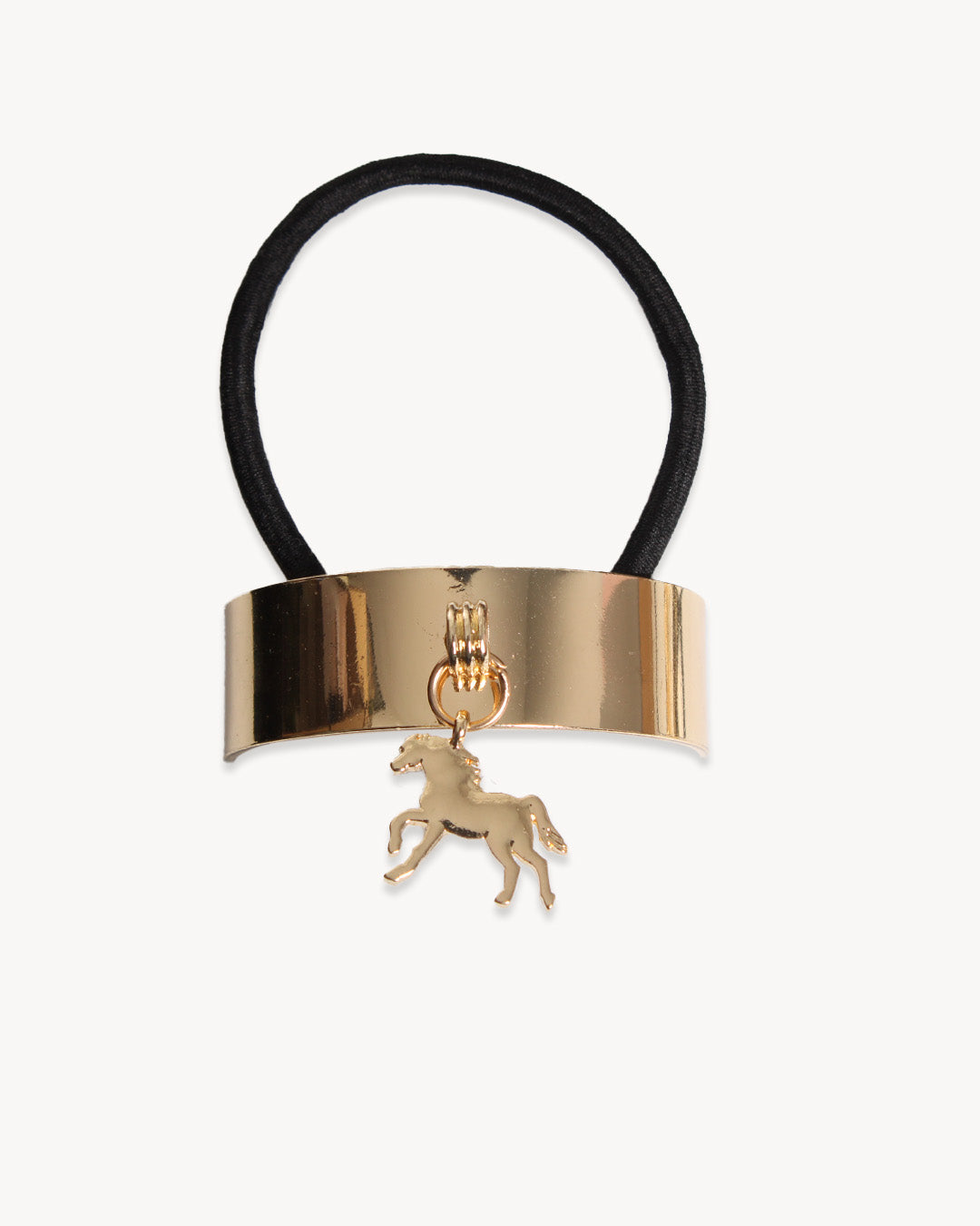 Gold hair tie with a horse charm on a white background