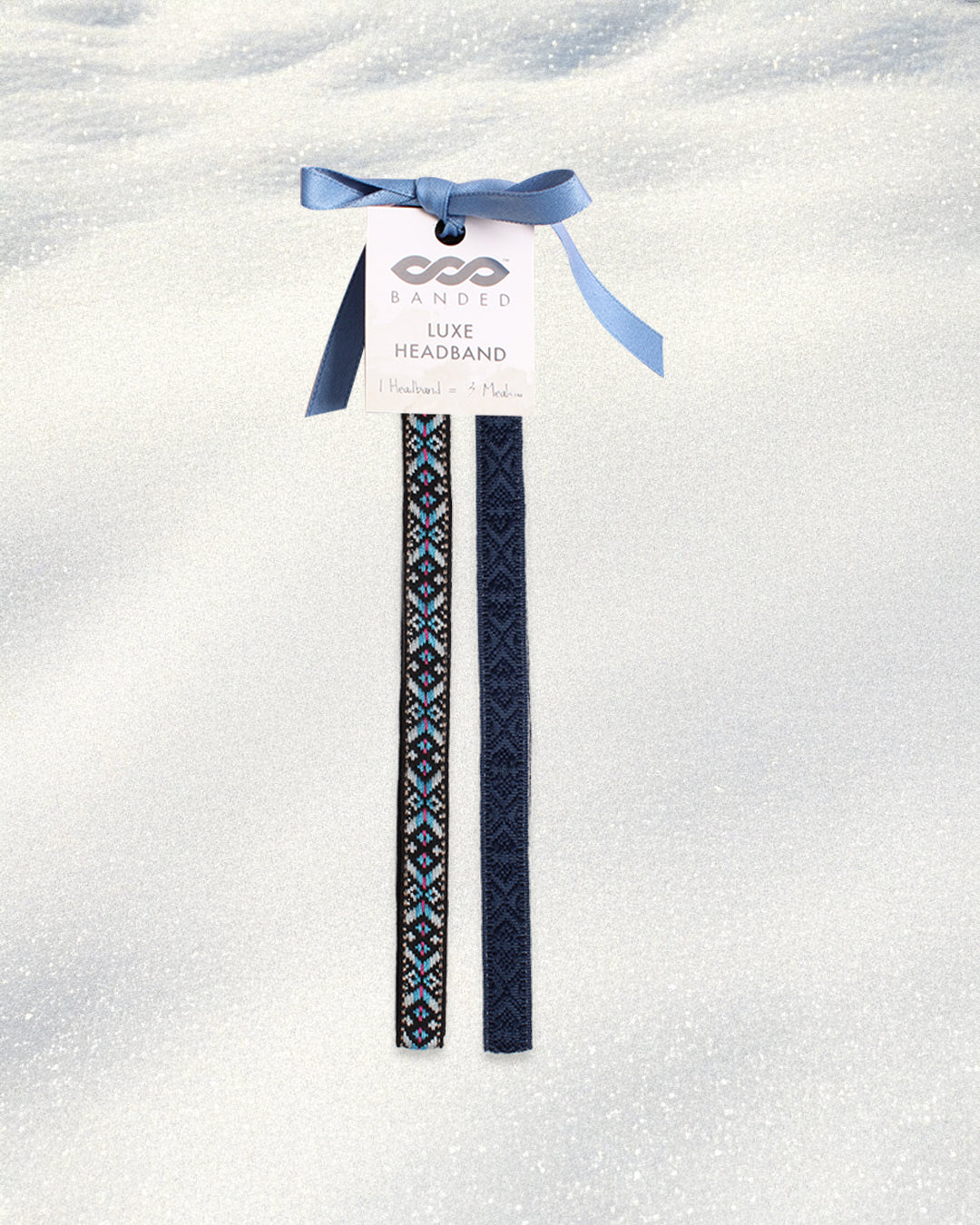 Navy blue headband with pattern on a white background