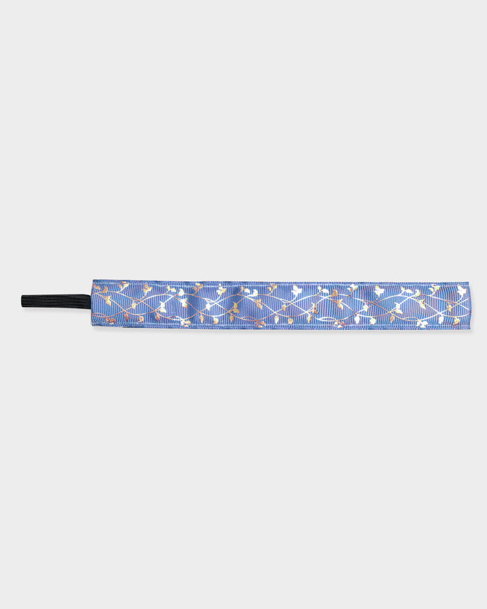 Blue headband with gold vine pattern on a light gray background