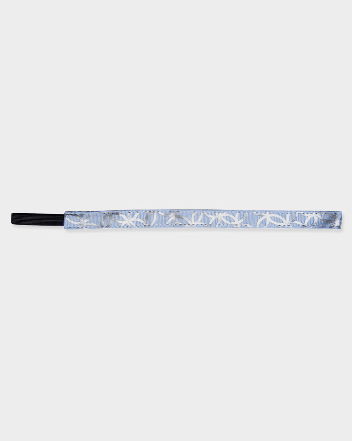 Headband with silver ring pattern on a white background