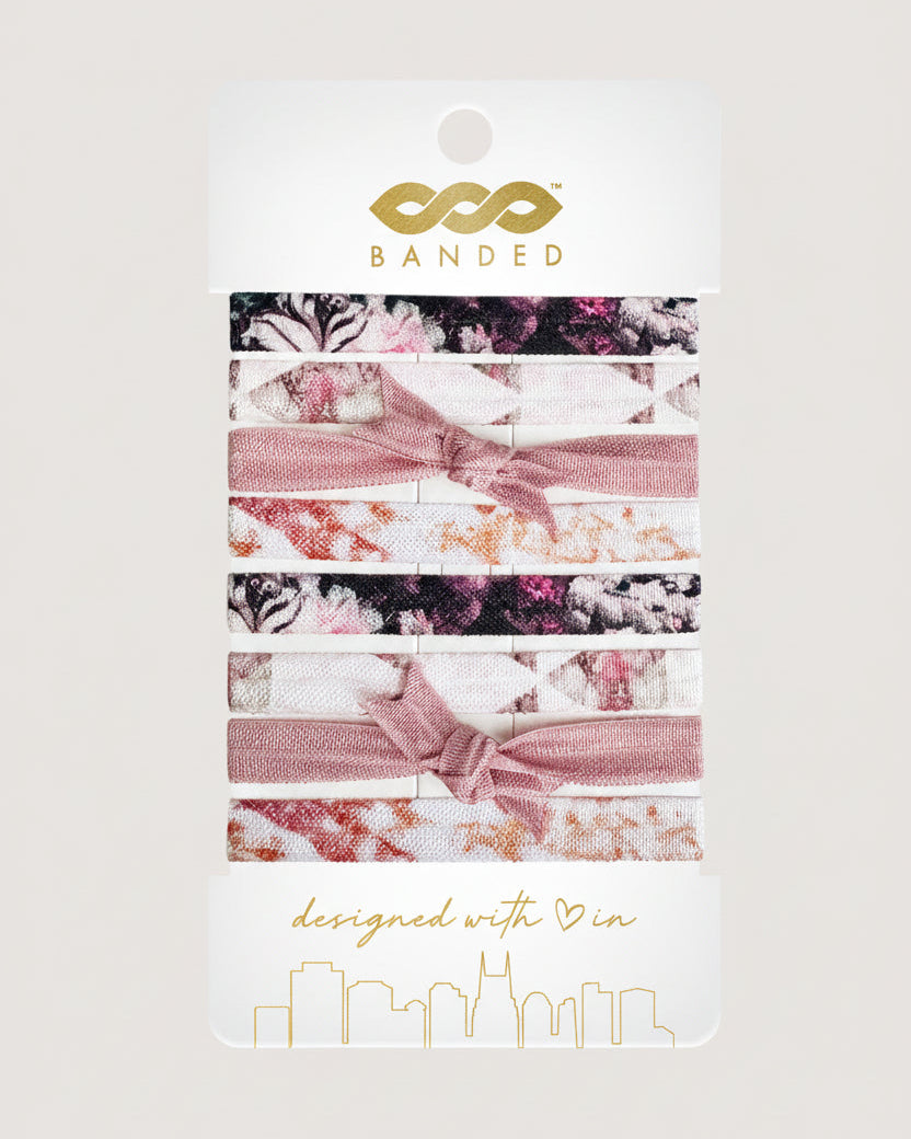Set of floral hair ties on a 'Banded' branded card with a white background