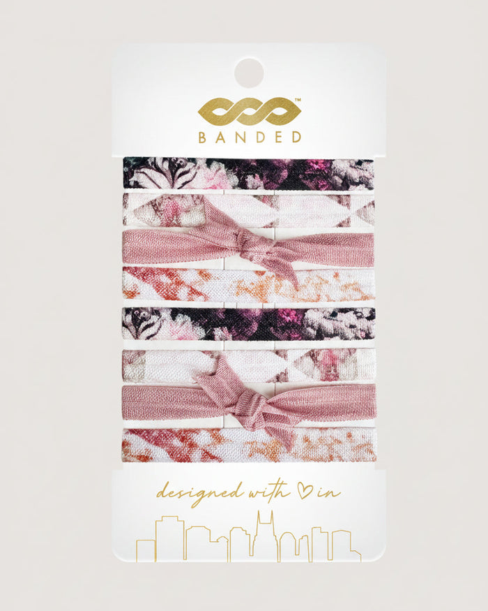 Set of floral hair ties on a 'Banded' branded card with a white background