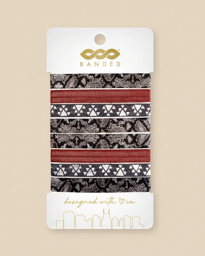 Packaged hair bands with various patterns on a white background, featuring the brand 'Banded'.